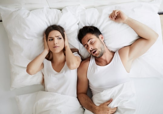 What are the best ways to stop snoring while sleeping?